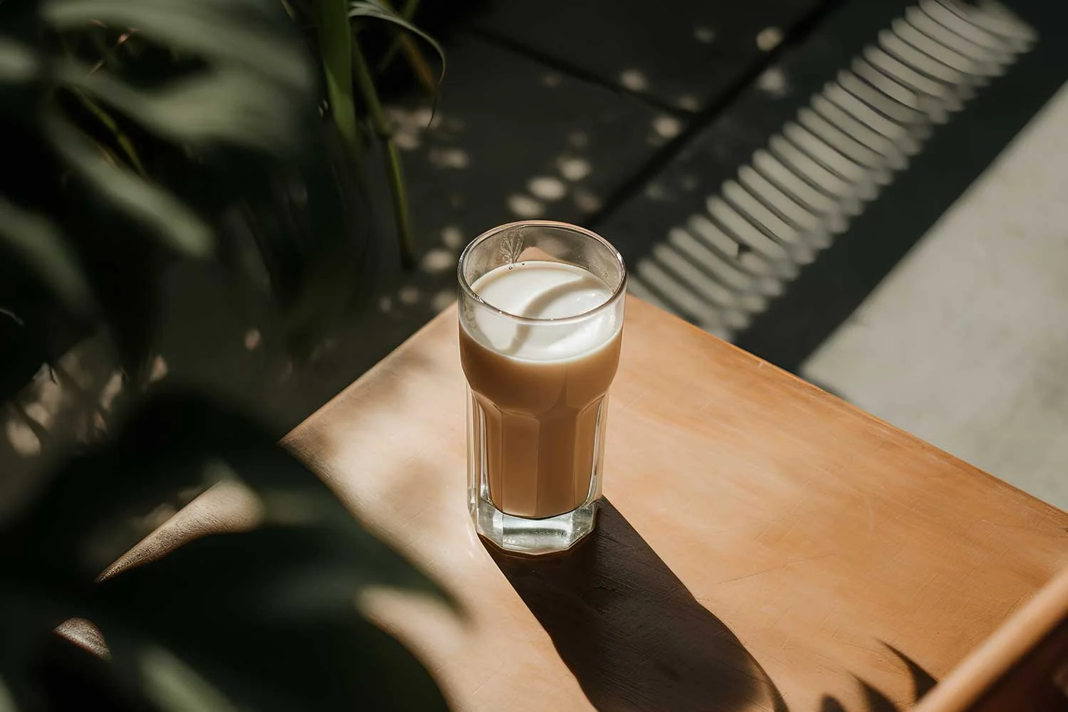 Glass of meal replacement shake on a wooden table