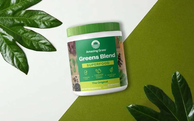 Amazing grass greens blend superfood on leafy background