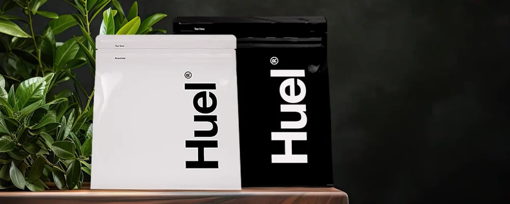 huel powder on dark leafy background