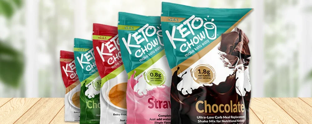 Keto chow keto meal replacement shakes on wooden background.