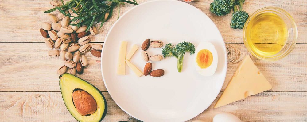 Keto diet high in protein foods on a wooden background.