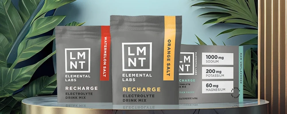 Different flavors of LMNT products on leafy background.