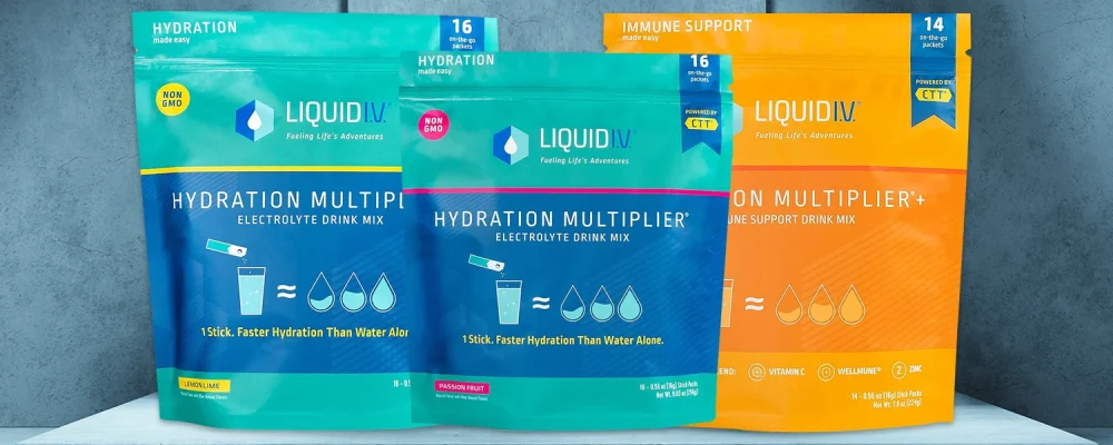 Three Liquid I.V. hydration drink packets on a dark background
